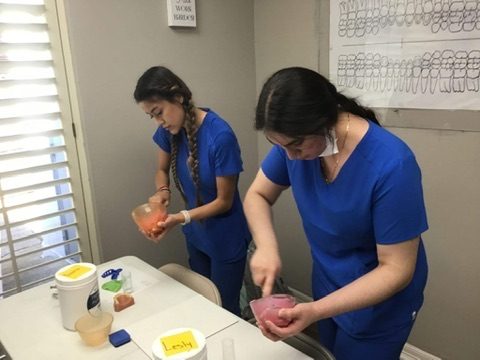 Hands-on skills practice at a training table at the Longview campus